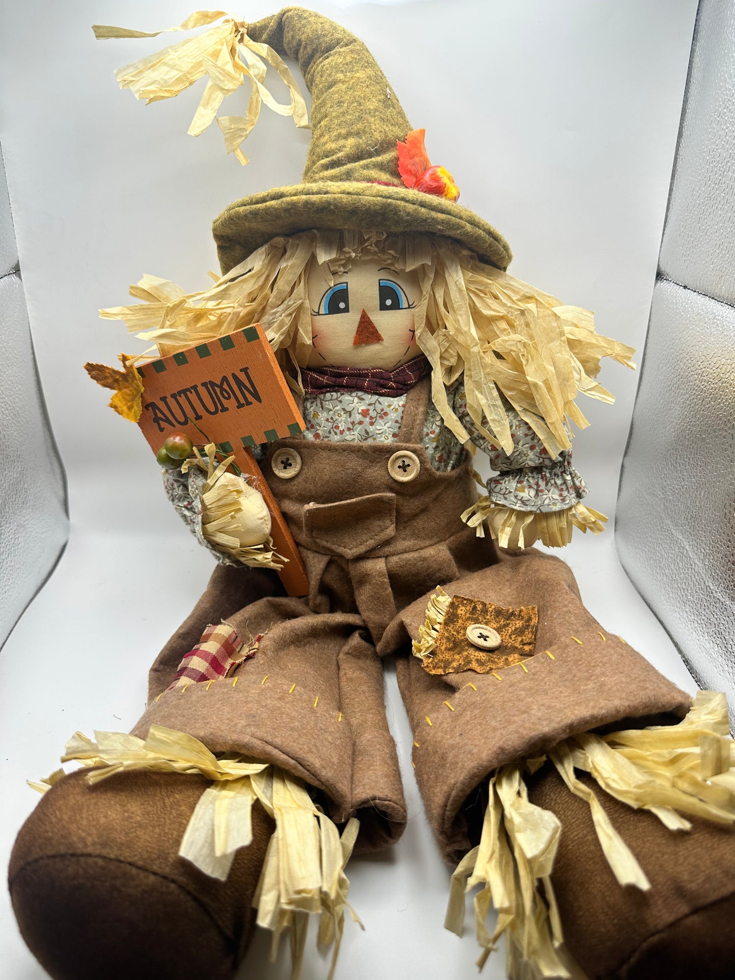 Scarecrow with Orange Autumn Sign