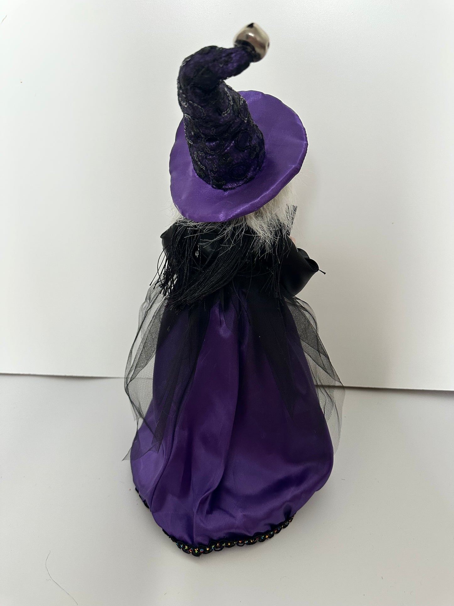 Witch with Purple Dress and Book of Spells